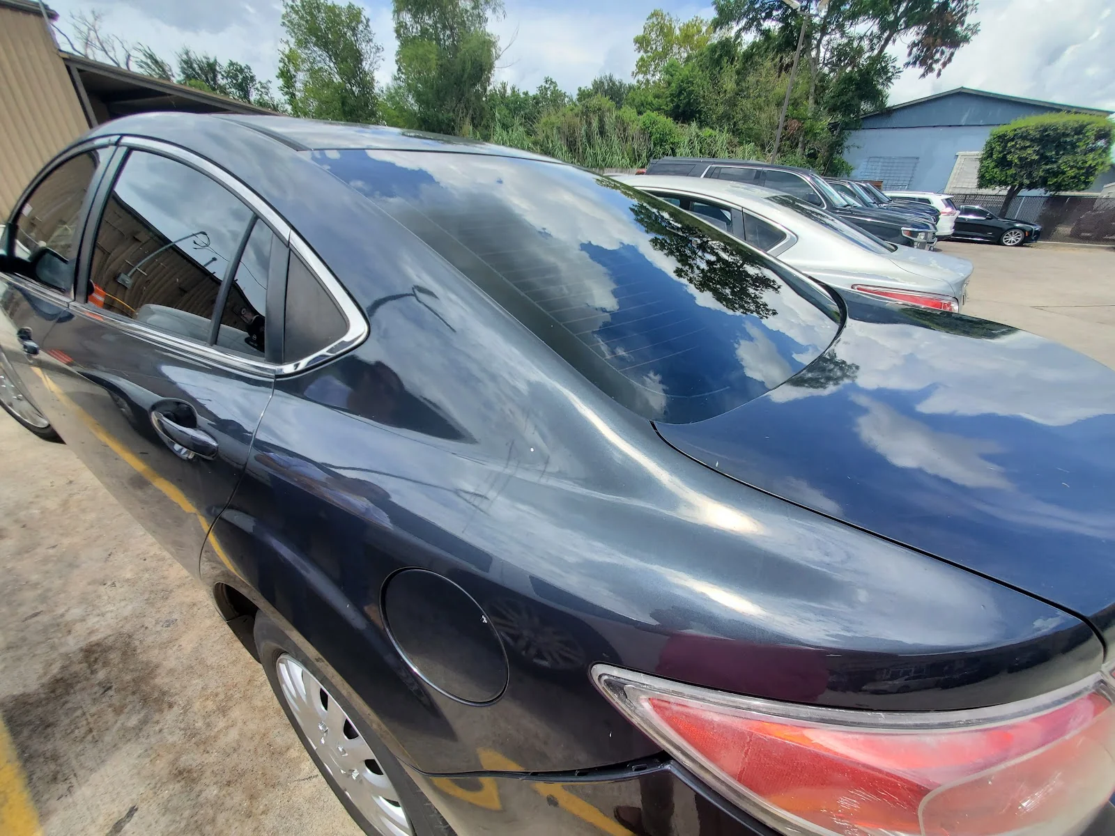 Inside Berrones Window Tint And Auto Care — shop interior and work bay